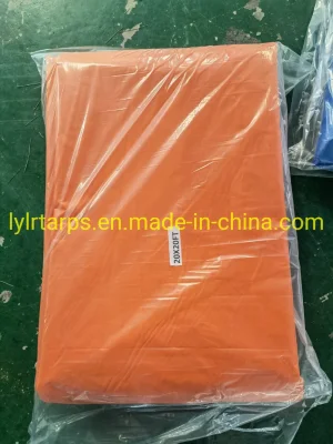 Bâche en PVC orange finie avec œillets et cordes galvanisés